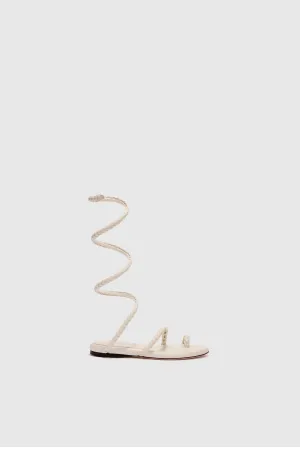 Flat sandal in smooth calfskin with hand-woven lacing